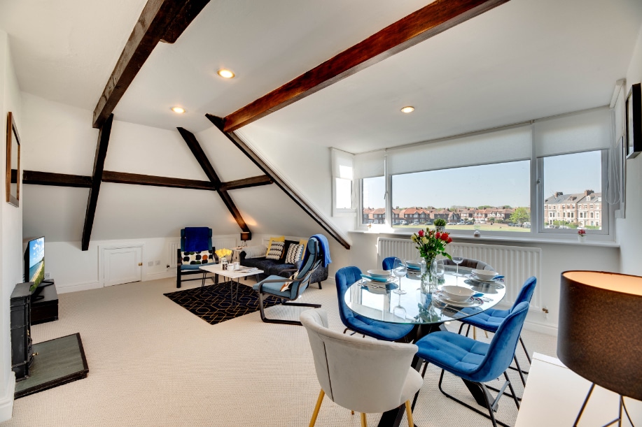 open plan living space with living room and dining area