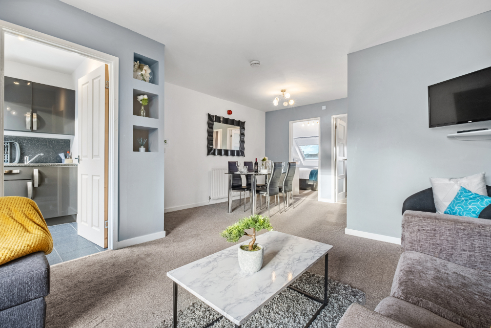 Sandyford Apartment - open plan living area with dining table