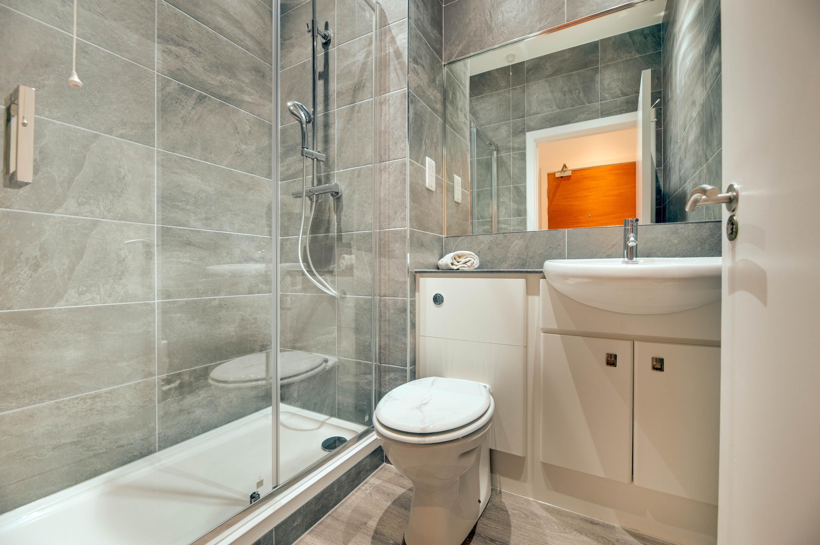 Crown Apartments Studio - bathroom with walk in shower